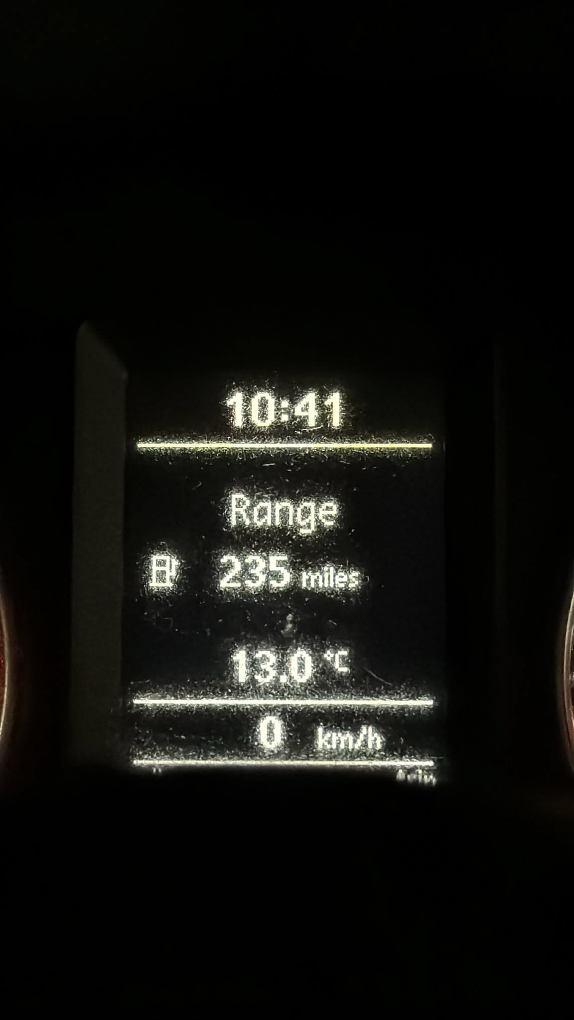 Van trip computer display showing a fuel range of 235 miles on a road test