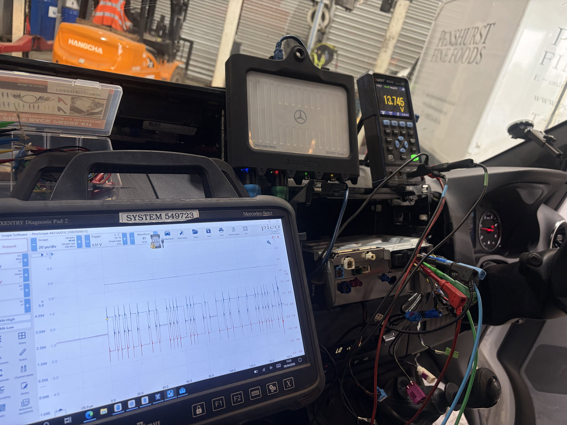 Mercedes XENTRY Diagnosis Pad running PicoScope, a XENTRY Scope module and a multimeter all wired into a van on the customer's premises