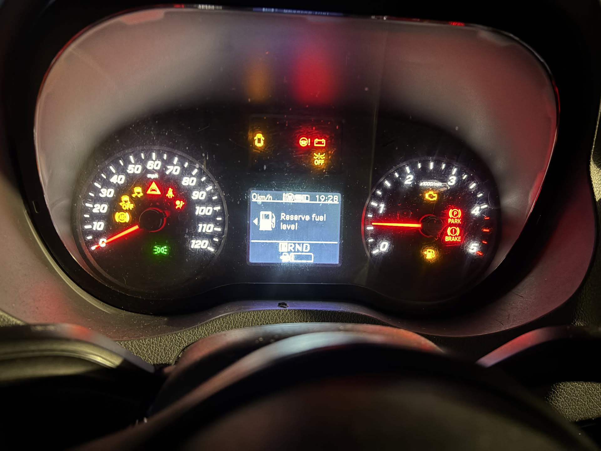 Van instrument cluster lit up with multiple warning lights