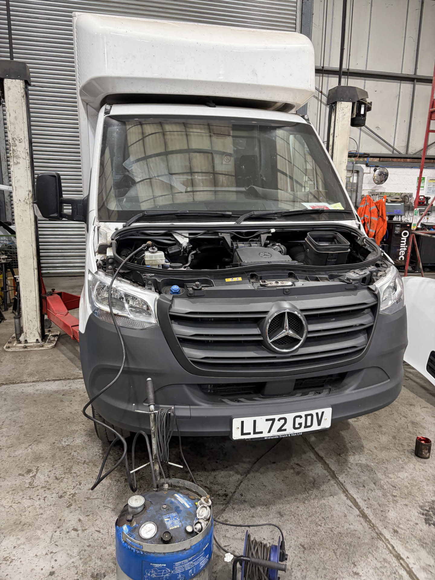Mercedes Sprinter with the bonnet up in the workshop before a remap