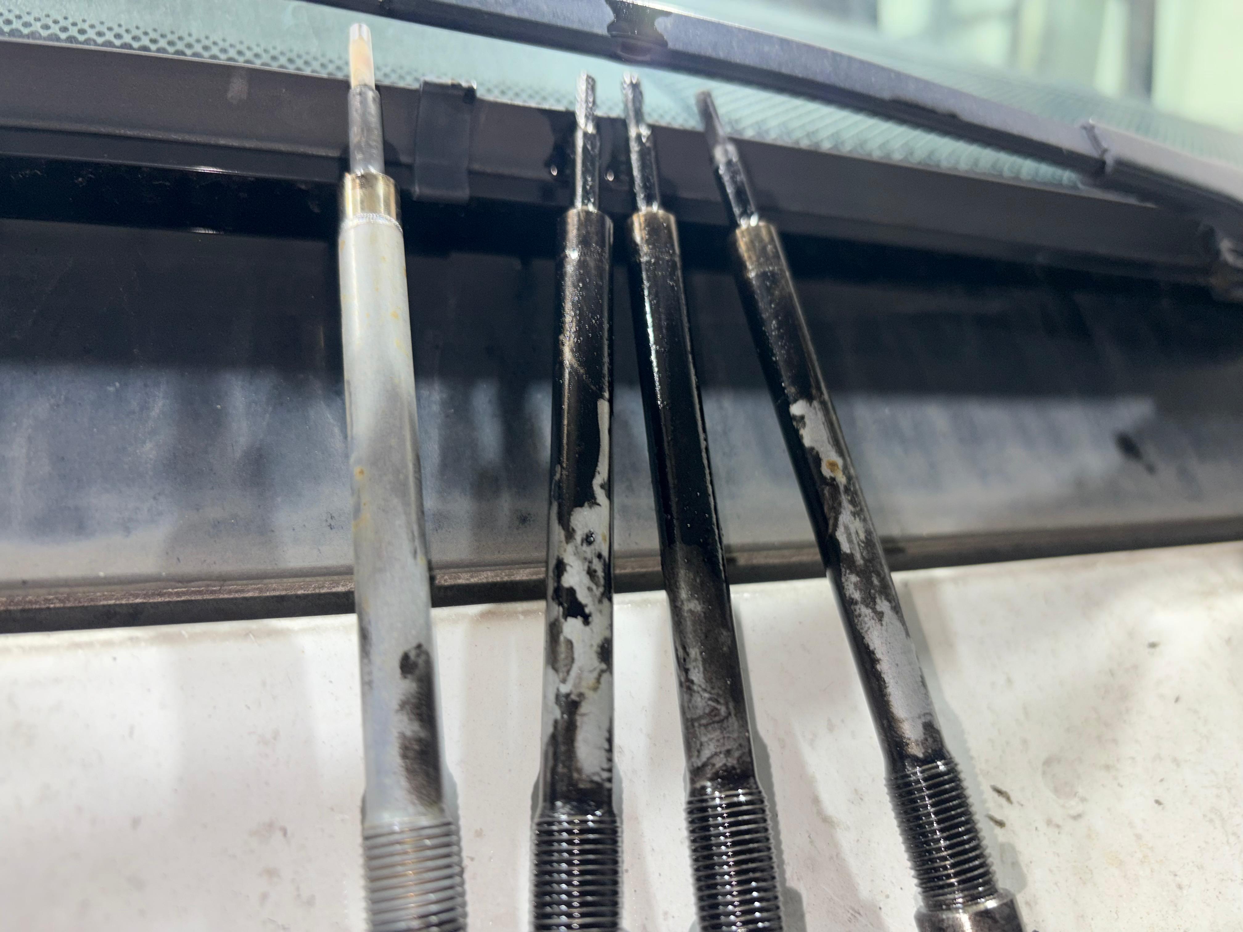 Oil-contaminated glow plugs removed from OM654 engine after turbo failure