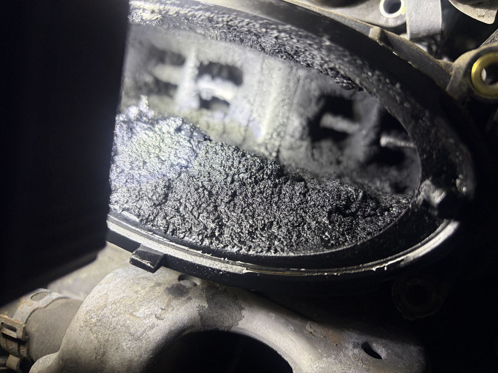 Heavily carbon-blocked intake manifold removed during diagnosis on a Mercedes diesel