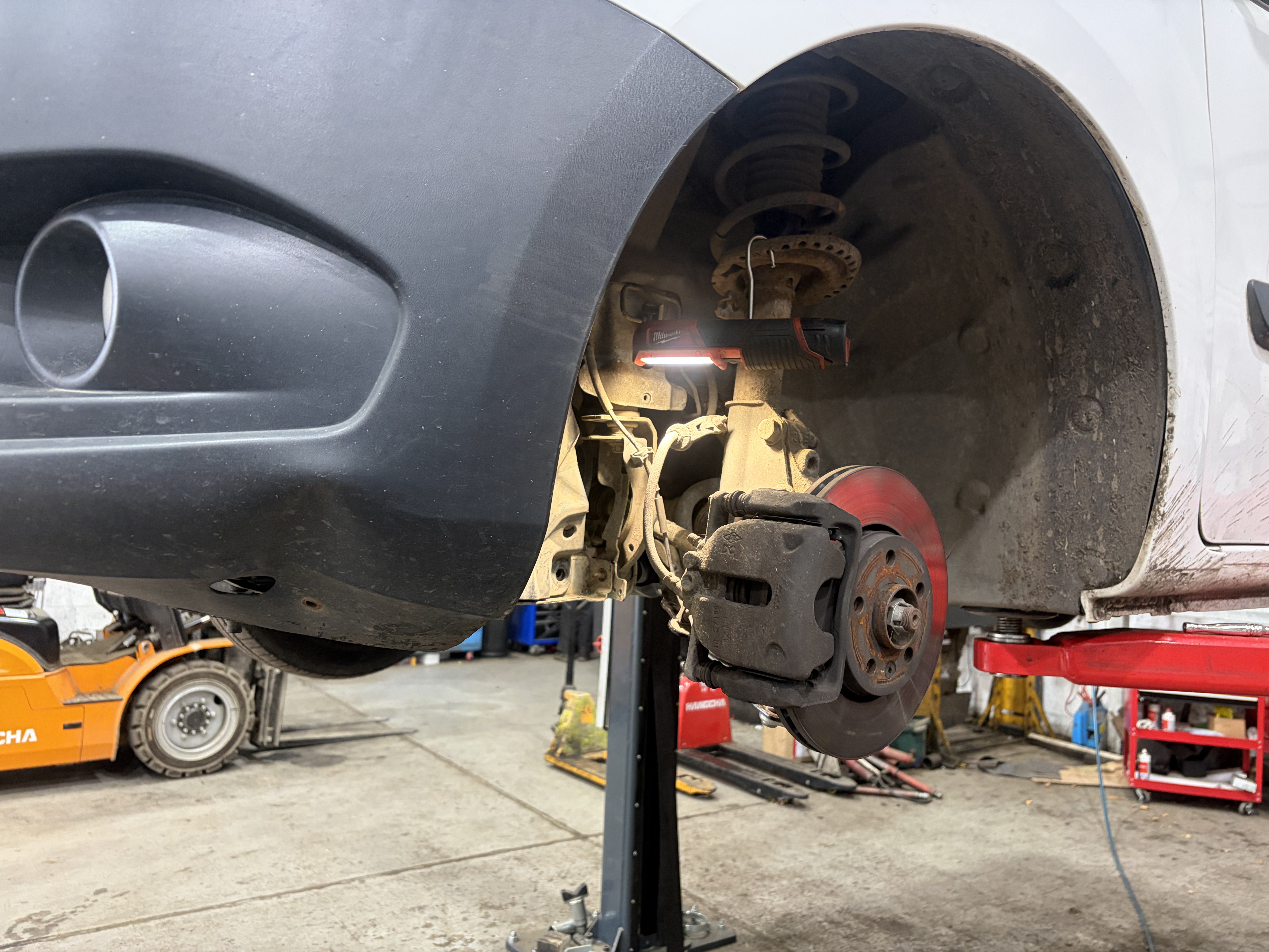 Mercedes Citan front brake disc and caliper during pad replacement