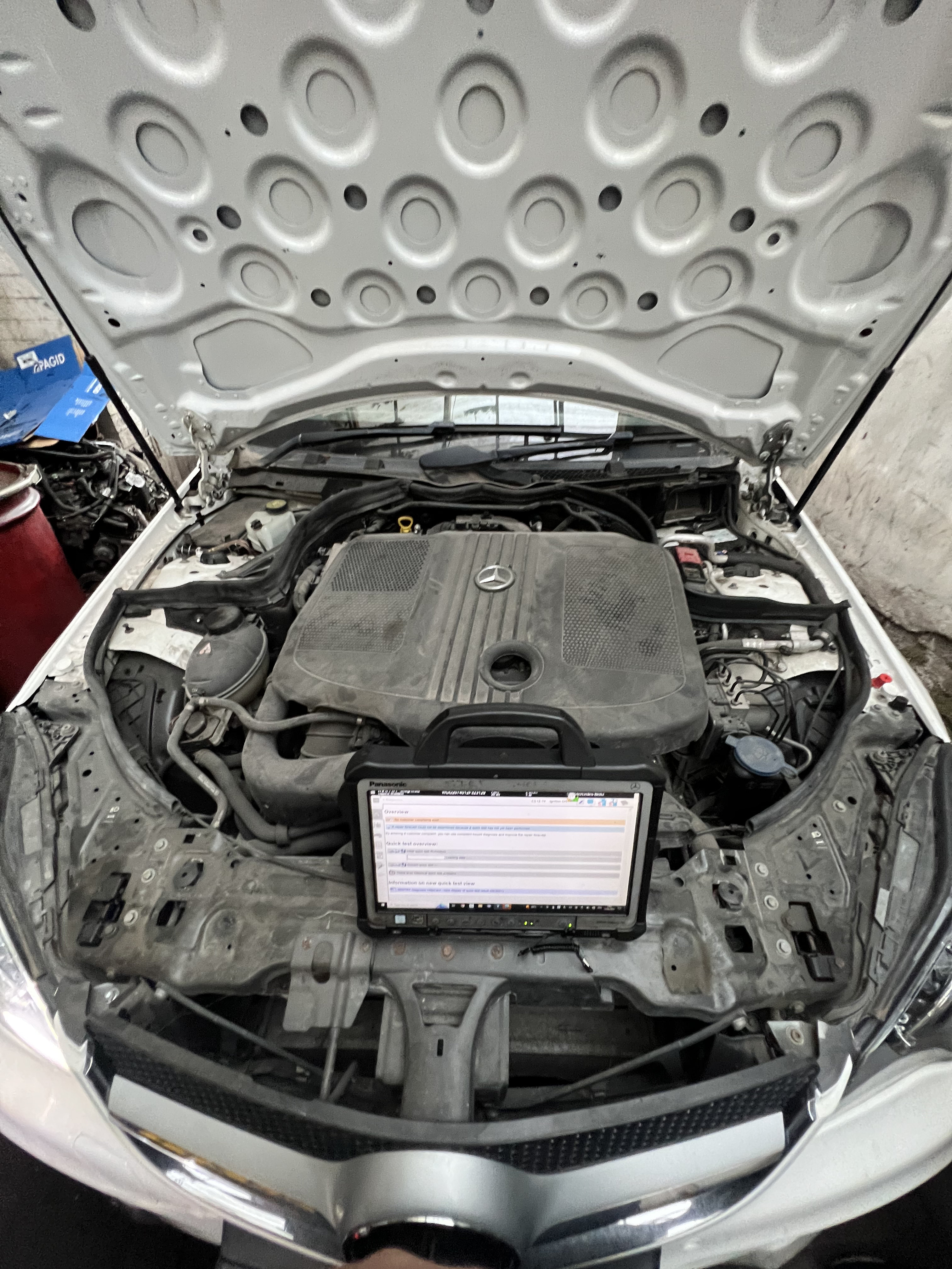 Mercedes Xentry dealer diagnostics laptop connected for commercial van fault finding