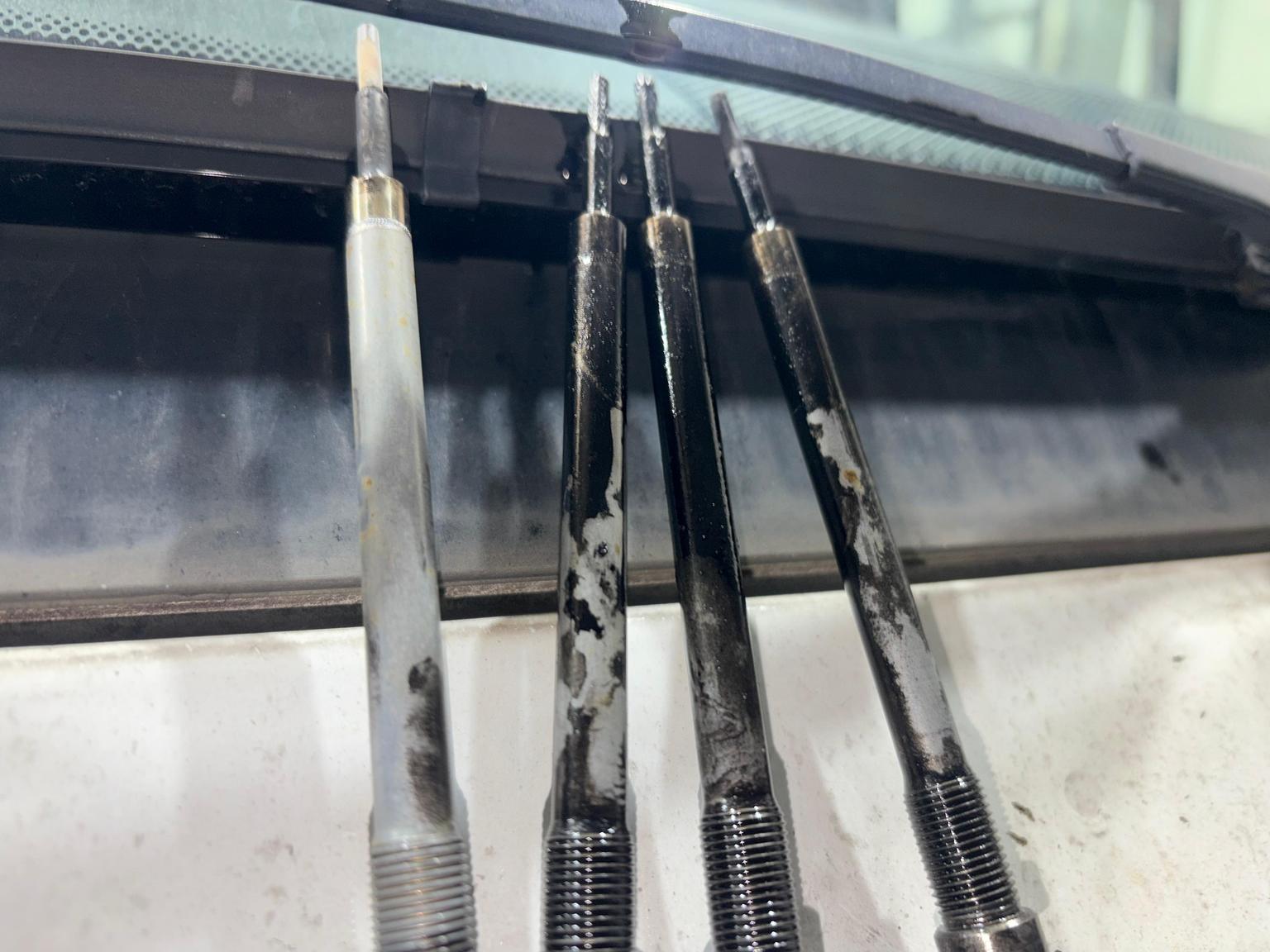 Oil-contaminated glow plugs removed from OM654 engine after turbo failure