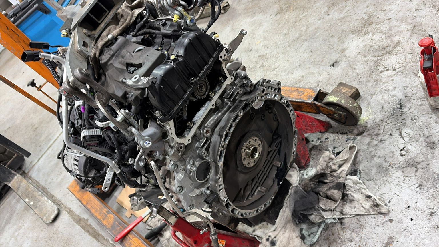Mercedes OM651 diesel engine removed and on floor jack