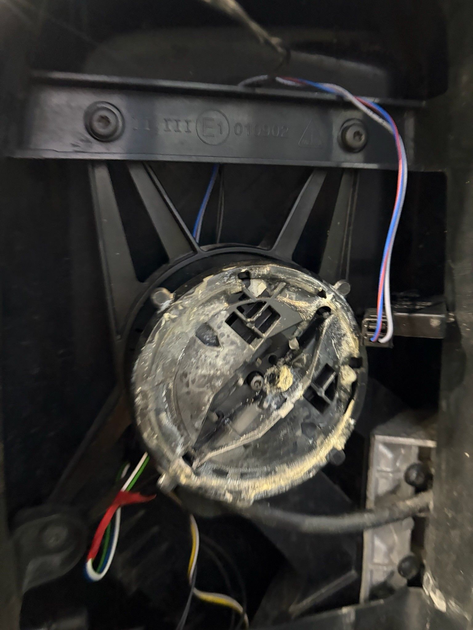 Internal door mirror motor housing with corroded wiring
