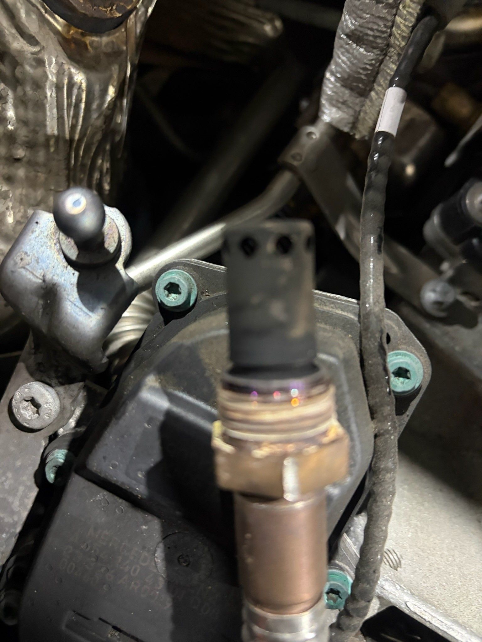 Soot-covered NOx sensor probe removed from engine