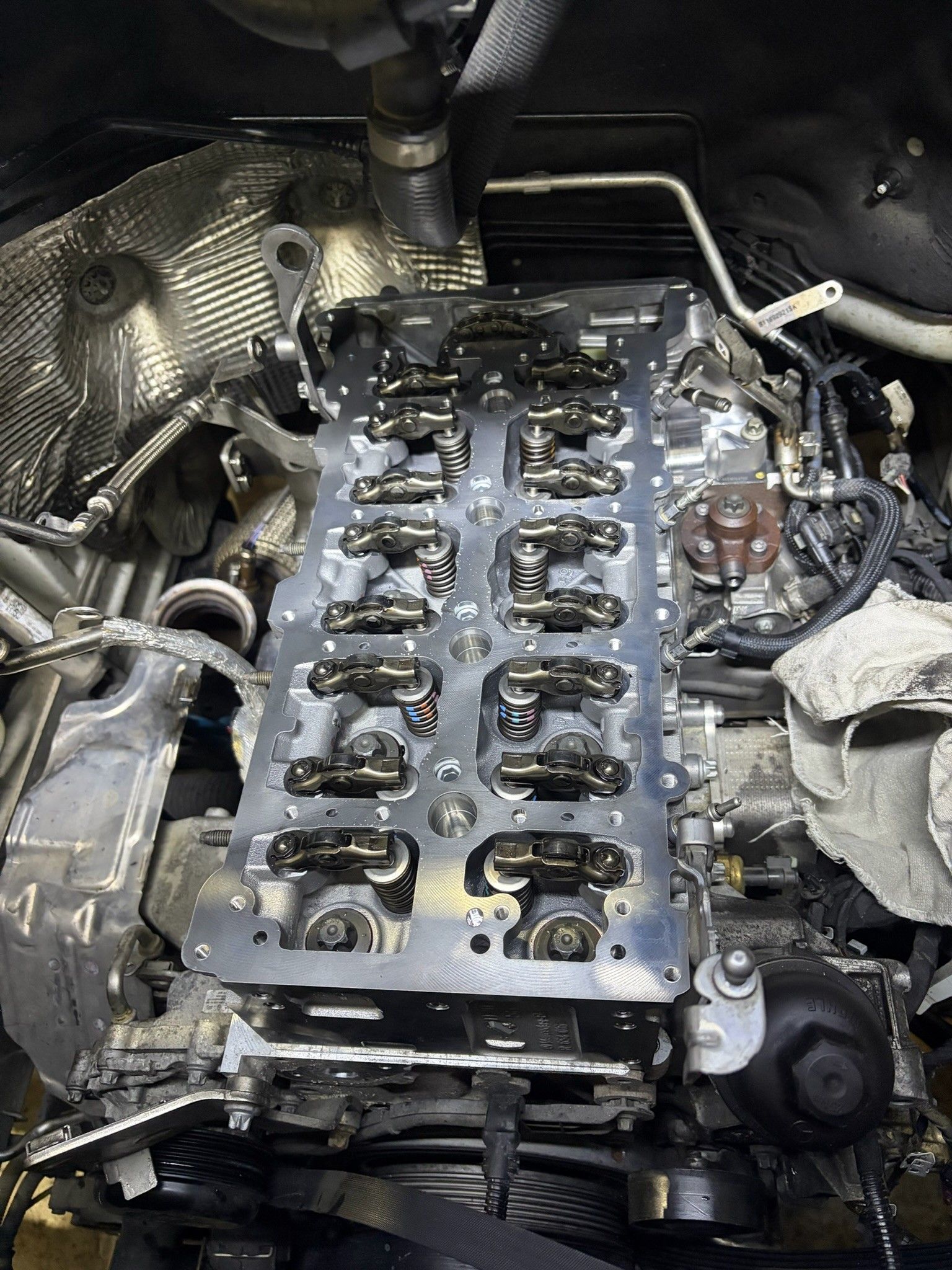 Exposed valve train and rocker arms in open engine bay