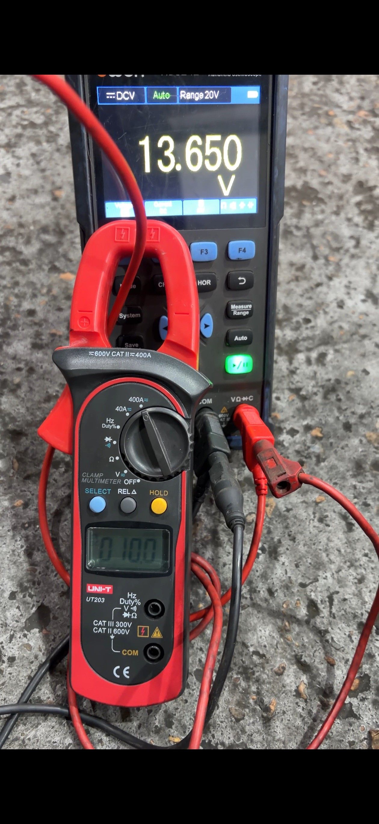 UNI-T multimeter and oscilloscope showing 13.65V battery test