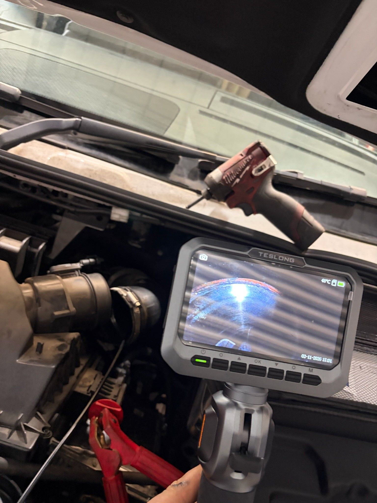 Teslong borescope inspecting Sprinter engine bay with Milwaukee tools