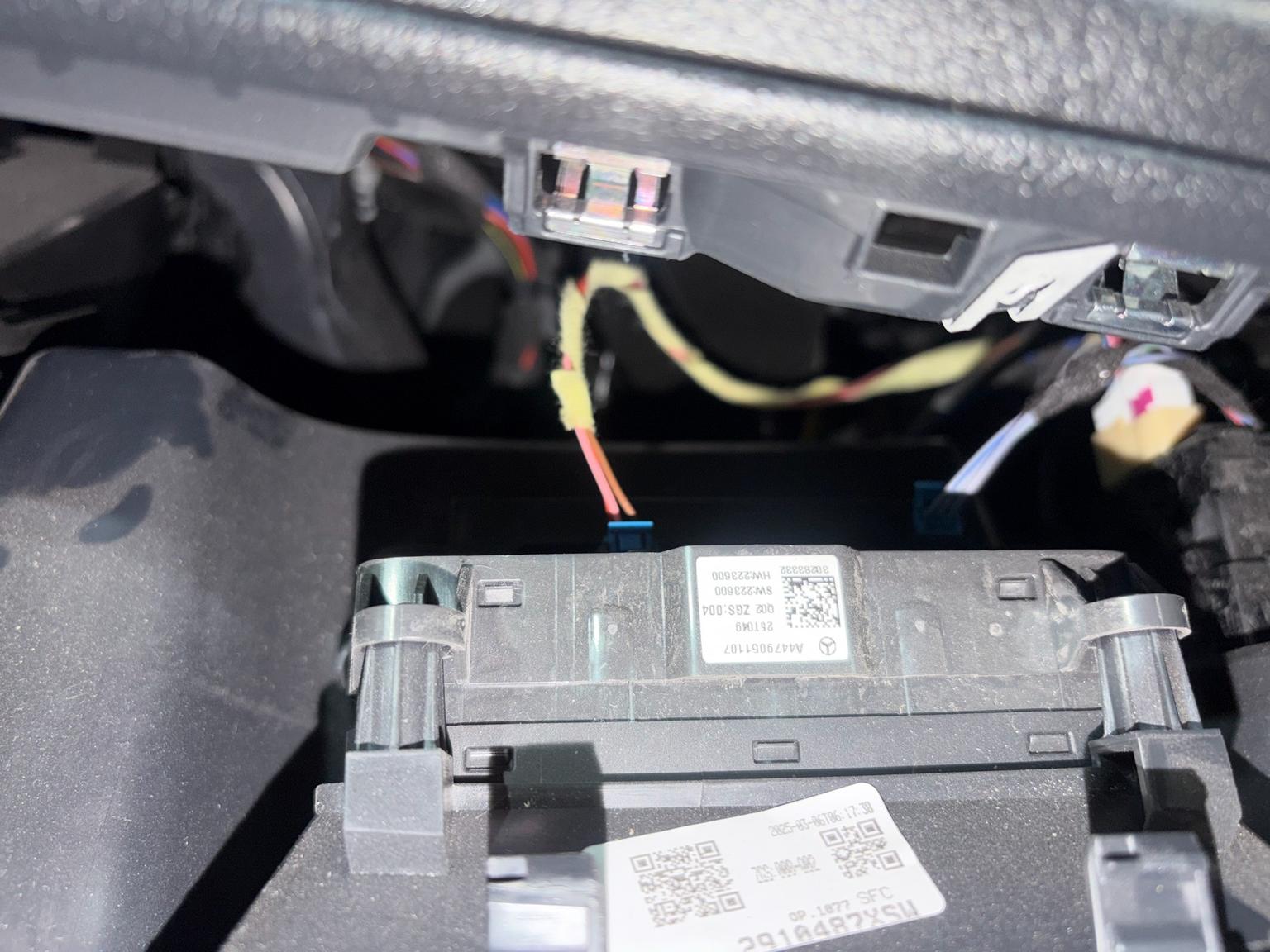 Mercedes ECU with A447 part number and wiring harnesses in dashboard