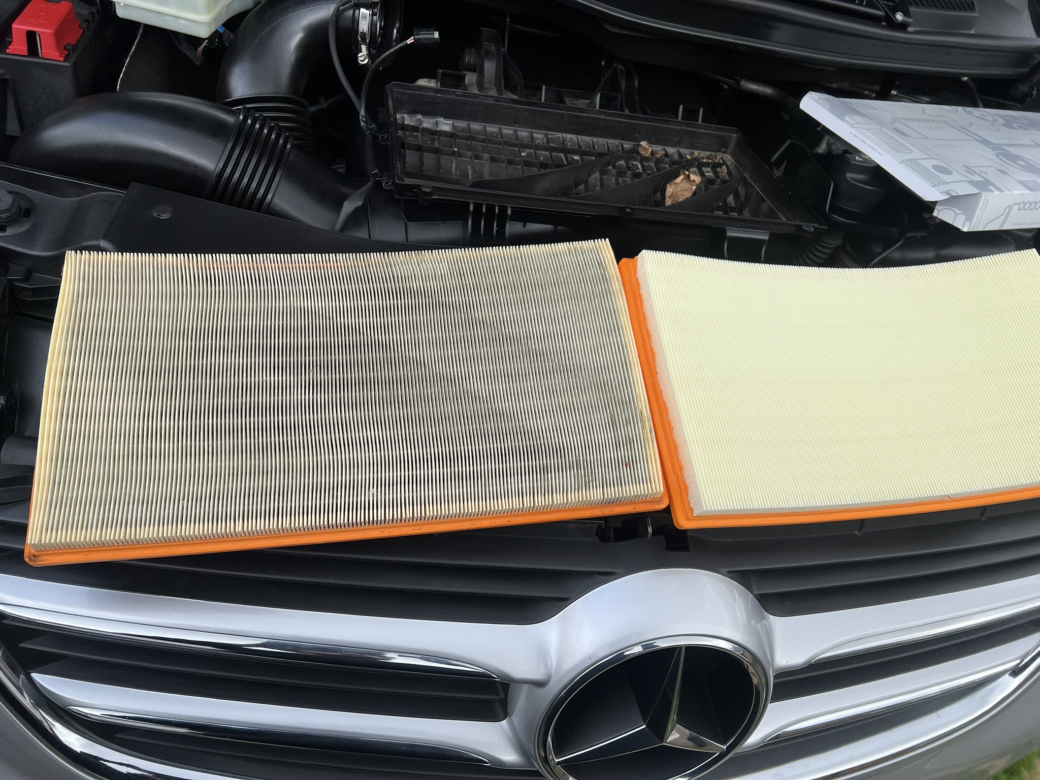 Old and new Mercedes air filters side by side