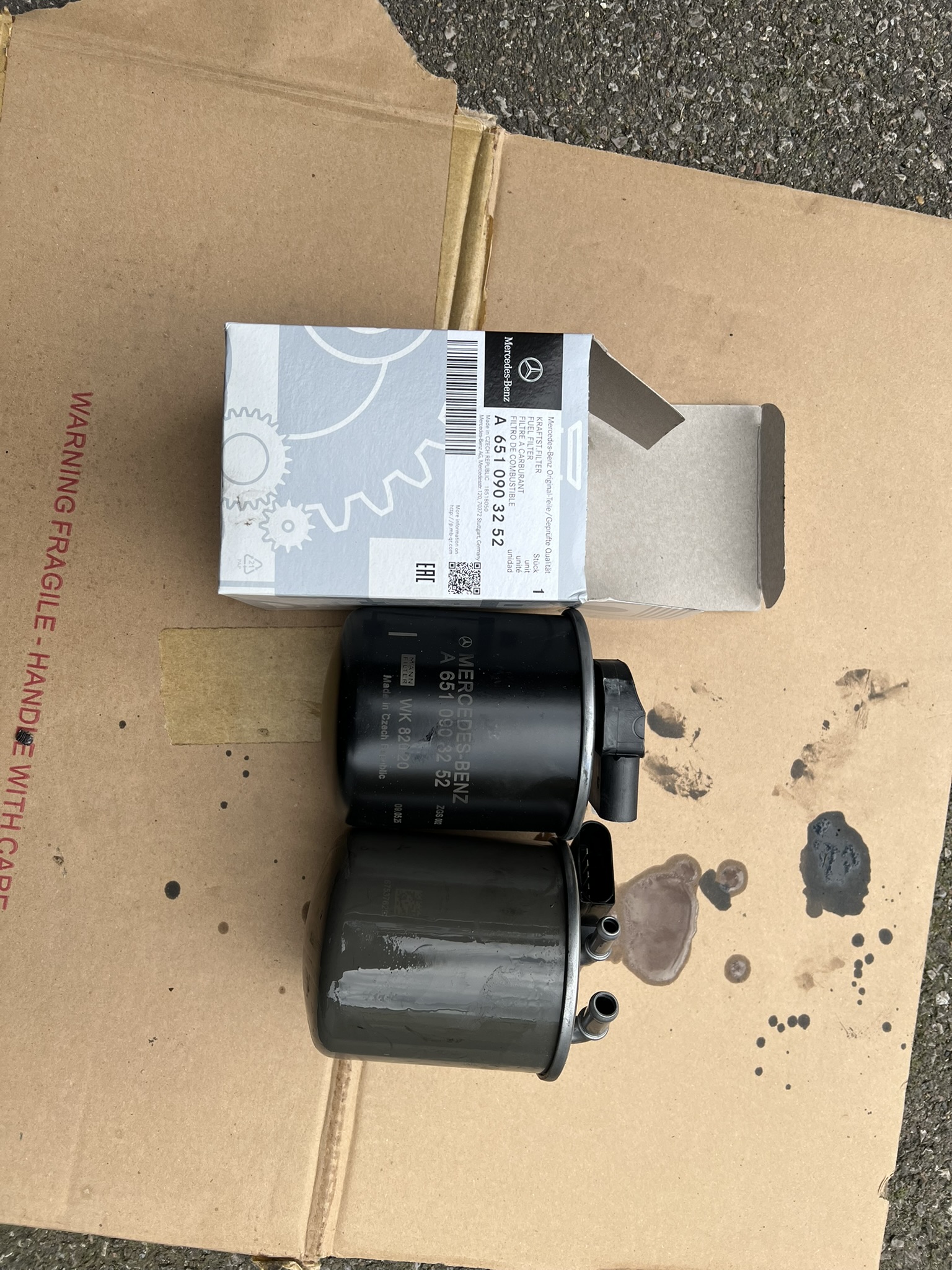 Old and new Mercedes fuel filters side by side