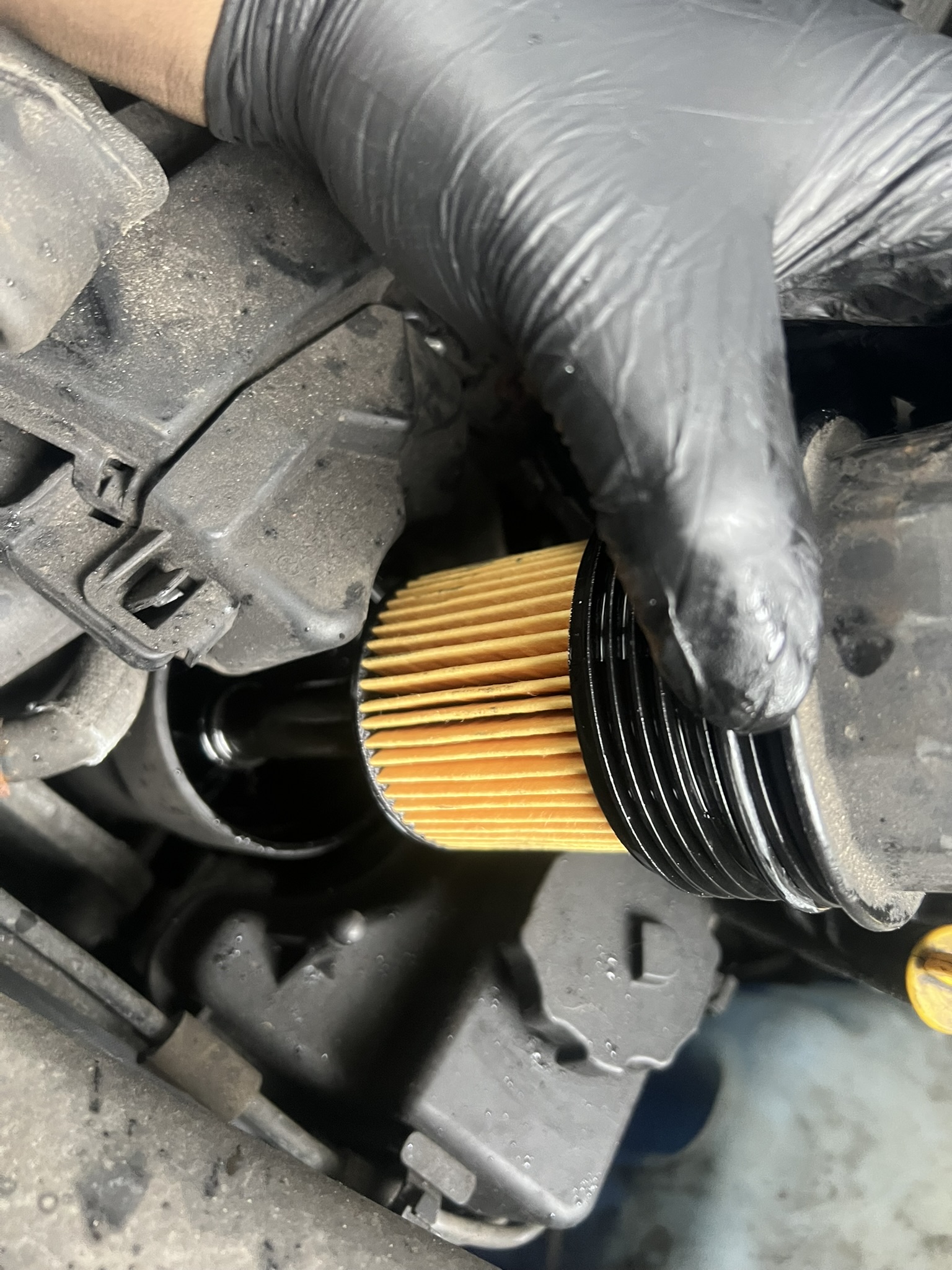 Genuine Mercedes oil filter being fitted