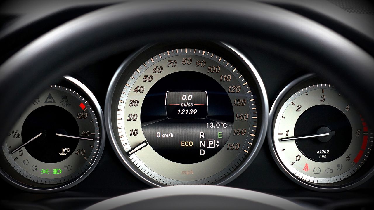 A Mercedes instrument cluster showing the odometer mileage on a used car